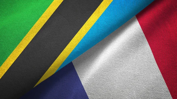 Tanzânia e França duas bandeiras de pano têxtil, textura de tecido — Fotografia de Stock