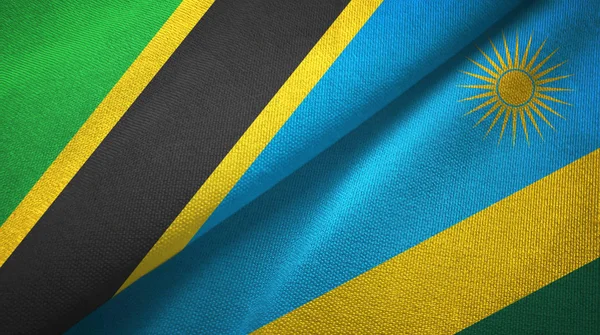 Tansania und Ruanda zwei Flaggen Textilstoff, Textur — Stockfoto