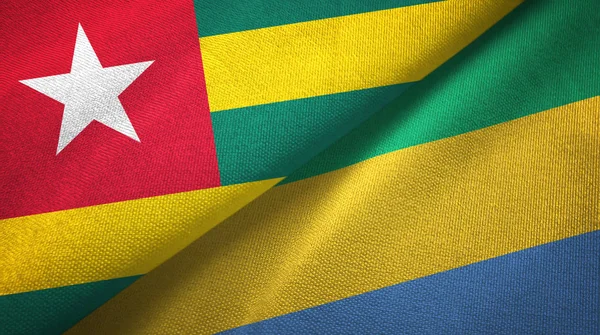 Togo y Gabón dos banderas tela textil, textura de la tela —  Fotos de Stock