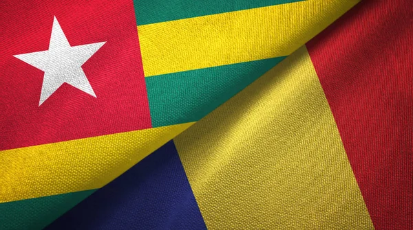 Togo en Roemenië twee vlaggen textiel doek, weefsel textuur — Stockfoto