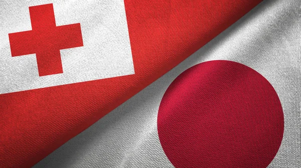 Tonga y Japón dos banderas tela textil, textura de la tela — Foto de Stock