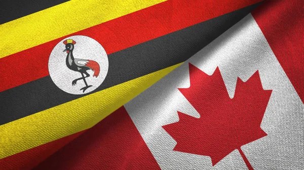Uganda ve Kanada iki bayraklar tekstil kumaş, kumaş doku 