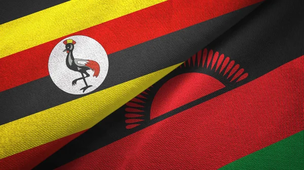 Uganda i Malawi dwie flagi tkanina tekstylna, tekstura tkaniny — Zdjęcie stockowe
