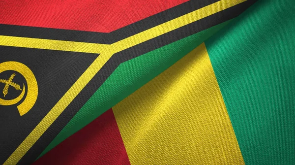 Vanuatu och Guinea Two flaggor textil trasa, tyg textur — Stockfoto