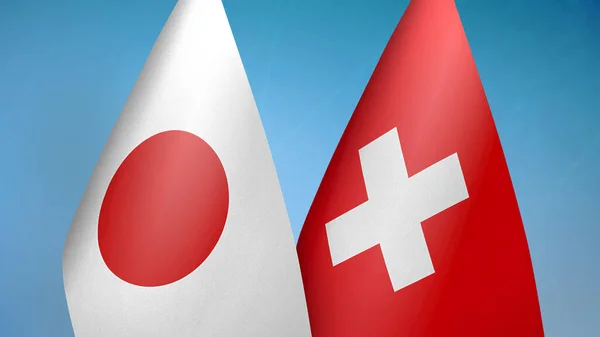 日本とスイスの国旗2旗が青い背景 — ストック写真