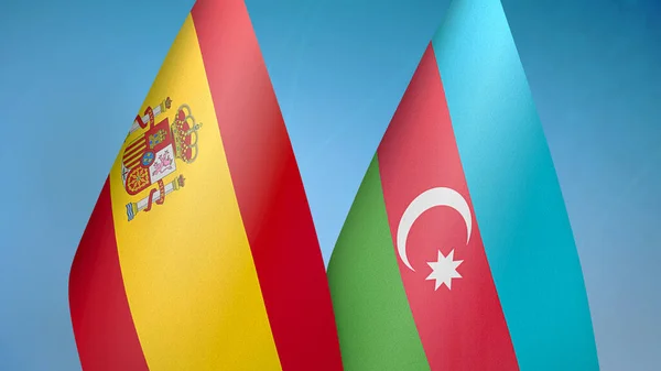 西班牙和阿塞拜疆的两面旗帜 蓝色背景 — 图库照片
