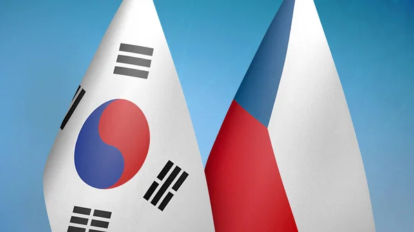 韓国とチェコの2つの国旗が青い背景を持っています — ストック写真