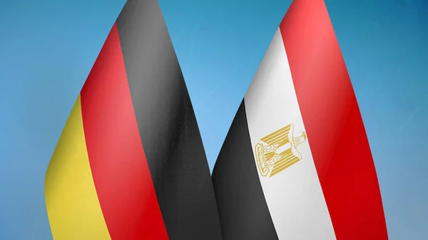 Germany and Egypt two flags together blue background
