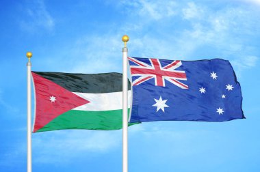 Ürdün ve Avustralya bayrak direkleri üzerinde iki bayrak ve mavi bulutlu arka plan