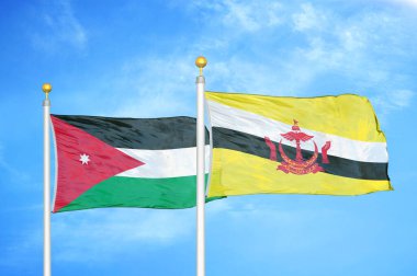 Ürdün ve Brunei Darussalam bayrak direkleri üzerinde iki bayrak ve mavi bulutlu arka plan