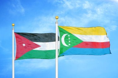 Ürdün ve Komoros bayrak direkleri üzerinde iki bayrak ve mavi bulutlu arka plan