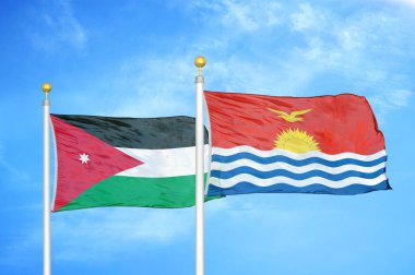 Ürdün ve Kiribati bayrak direğinde iki bayrak ve mavi bulutlu bir arka plan