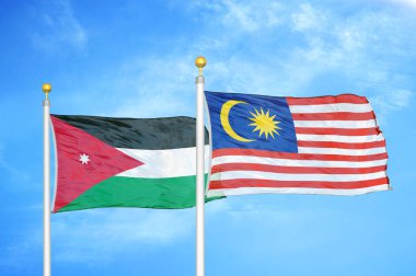 Ürdün ve Malezya bayrak direkleri üzerinde iki bayrak ve mavi bulutlu arka plan