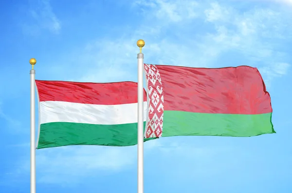 Hungary Belarus Two Flags Flagpoles Blue Cloudy Sky Background — Stock Photo, Image