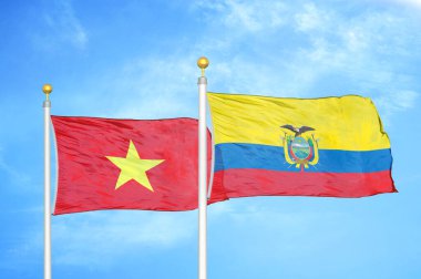 Vietnam ve Ekvador bayrak direkleri ve mavi bulutlu arka planda iki bayrak