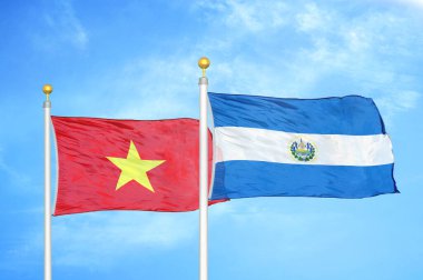 Vietnam ve El Salvador bayrak direkleri ve mavi bulutlu arka planda iki bayrak