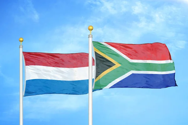 Netherlands South Africa Two Flags Flagpoles Blue Cloudy Sky Background — Stock Photo, Image