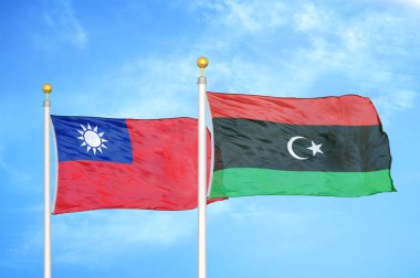 Tayvan ve Libya bayrak direkleri ve mavi bulutlu arka planda iki bayrak