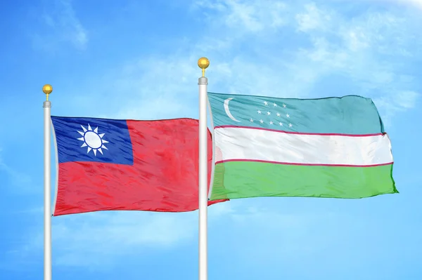 Taiwan Uzbekistan Two Flags Flagpoles Blue Cloudy Sky Background — Stock Photo, Image