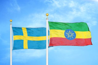 İsveç ve Etiyopya bayrak direkleri ve mavi bulutlu arka planda iki bayrak