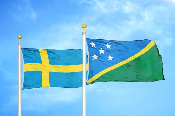 Sweden Solomon Islands Two Flags Flagpoles Blue Cloudy Sky Background — Stock Photo, Image