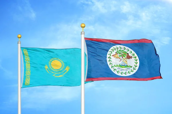 Cazaquistão Belize Duas Bandeiras Postes Bandeira Fundo Azul Céu Nublado — Fotografia de Stock