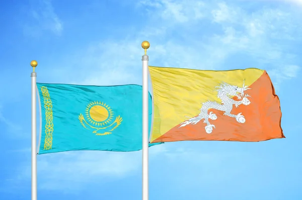 Kazakhstan Bhutan Two Flags Flagpoles Blue Cloudy Sky Background — Stock Photo, Image