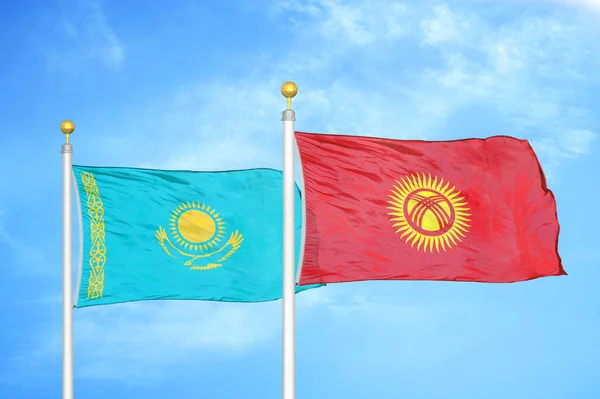 Kazakhstan Kyrgyzstan Two Flags Flagpoles Blue Cloudy Sky Background — Stock Photo, Image