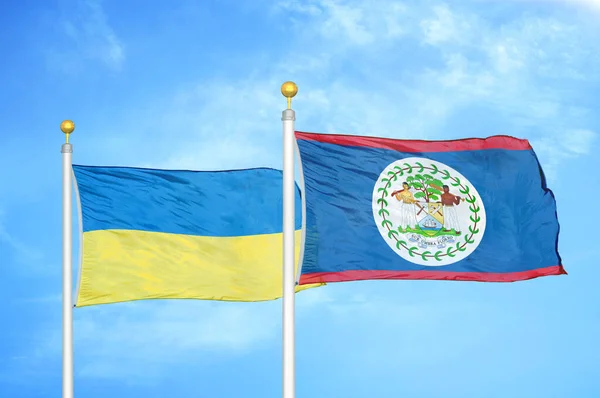 Ucrânia Belize Duas Bandeiras Postes Bandeira Azul Céu Nublado Fundo — Fotografia de Stock