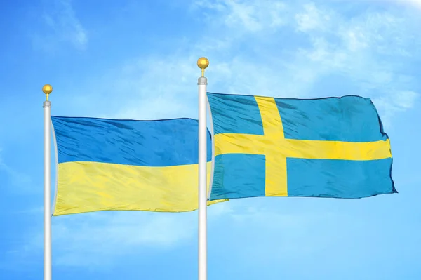 Ukraina Och Sverige Två Flaggor Flaggstänger Och Blå Molnig Himmel — Stockfoto
