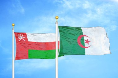 Umman ve Cezayir bayrak direğinde iki bayrak ve mavi bulutlu arka plan