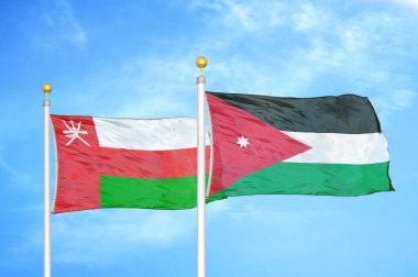 Umman ve Jordan bayrak direğinde iki bayrak ve mavi bulutlu arka plan