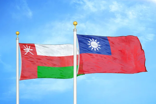 Oman Taiwan Two Flags Flagpoles Blue Cloudy Sky Background — Stock Photo, Image