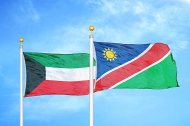 Kuveyt ve Namibya bayrak direkleri üzerinde iki bayrak ve mavi bulutlu arka plan