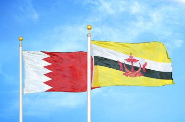 Bahreyn ve Brunei bayrak direğinde iki bayrak ve mavi bulutlu arka plan