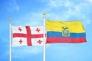 Gürcistan ve Ekvador bayrak direkleri ve mavi bulutlu arka planda iki bayrak