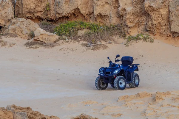 Picture of quadbike on the desert road.