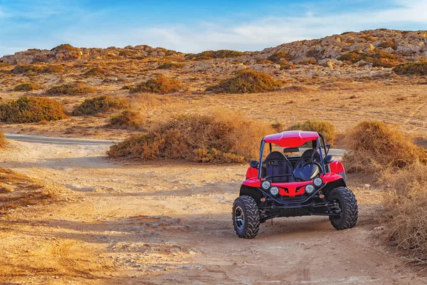 Picture of quadbike on the desert road.