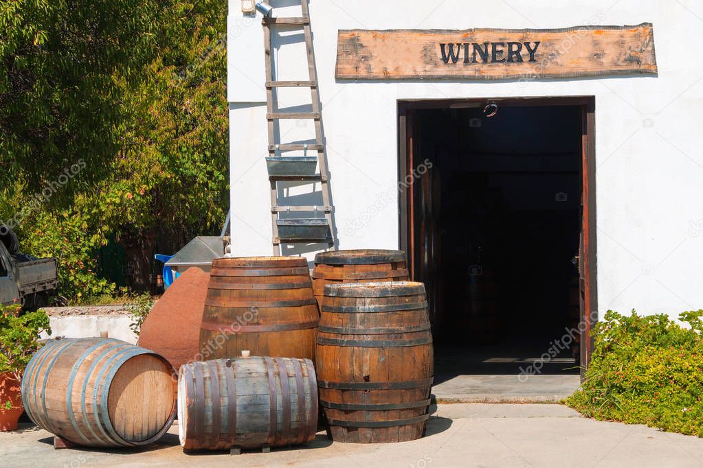 PIcture of wooden winery barrels in Crete.