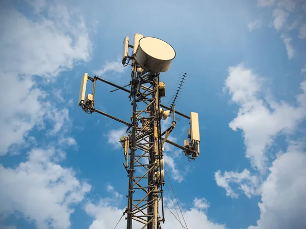 3G, 4G and 5G cellular. Base Station or Base Transceiver Station. Telecommunication tower. Wireless Communication Antenna Transmitter. Telecommunication tower with antennas against blue sky.