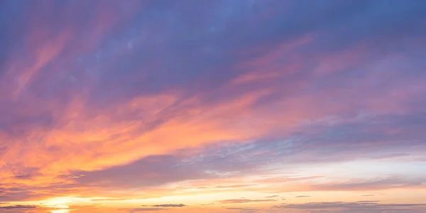 Vibrant color panoramic sun rise and sun set sky with cloud on a cloudy day.