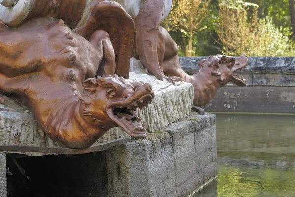 statue of a painted lead dragon in the gardens of royal palace of la granja de san ildefonso in the province of segovia, spain