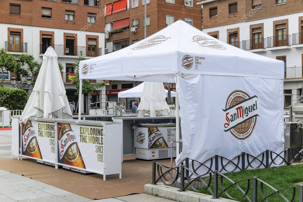 TORREJON DE ARDOZ, MADRID, SPAIN - MAY 25, 2018: stands of san miguel beer with the claim exploring the world during a celebration in the city of torrejon de ardoz