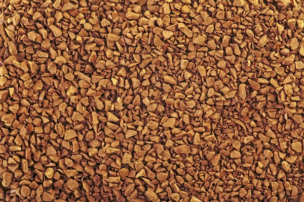 Granulated instant coffee, close up. Soluble coffee background.