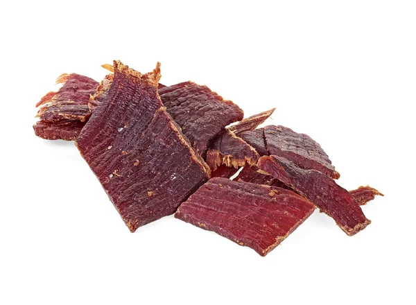 Pile of beef jerky pieces on a white background — Stock Photo, Image