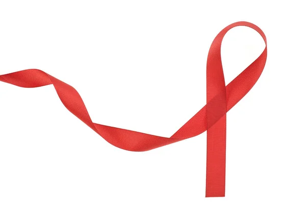 Red Awareness Ribbon com cachos em fundo branco — Fotografia de Stock