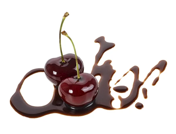 Two ripe cherries in liquid chocolate on a white background — Stock Photo, Image