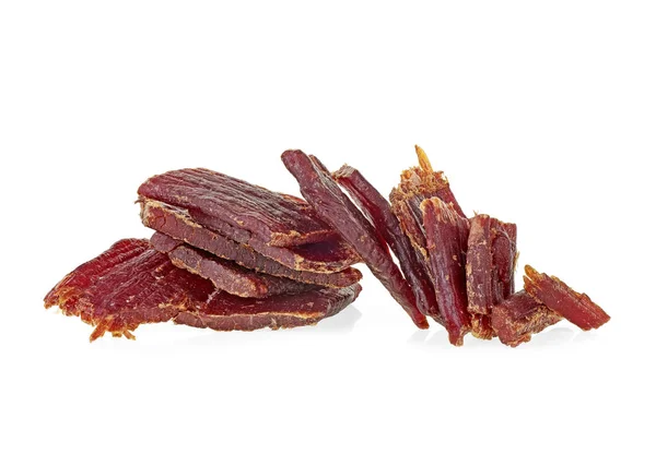 Portion of beef jerky on a white white background. Full depth of — Stock Photo, Image