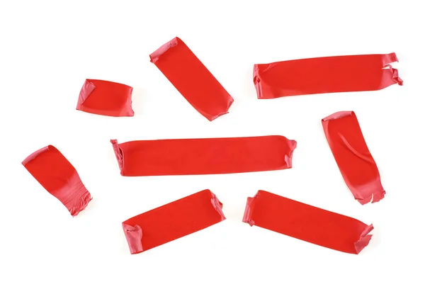 Conjunto de fatias de fita vermelha isoladas no fundo branco. Isolamento vermelho — Fotografia de Stock