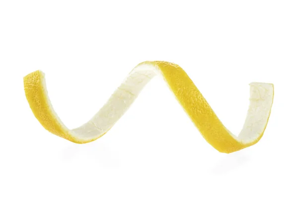 Citron twist på en vit bakgrund. Citronskal. — Stockfoto